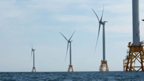A line of wind turbines in the sea off Long Island, New York State