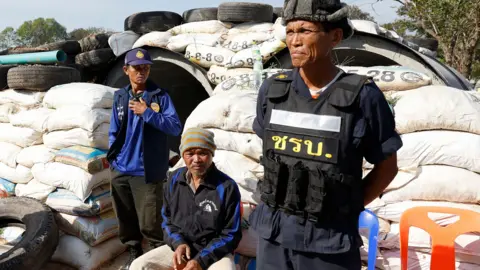 Three Thai security officers in casual clothes 